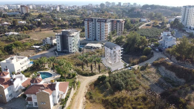 Квартиры 1+1 и 2+1 в новом ЖК на этапе строительства в районе Авсаллар фото 6