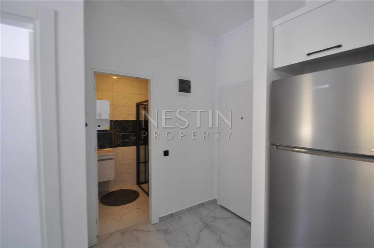 Меблированная квартира 1+1 в новом комплексе в районе Авсаллар фото 4