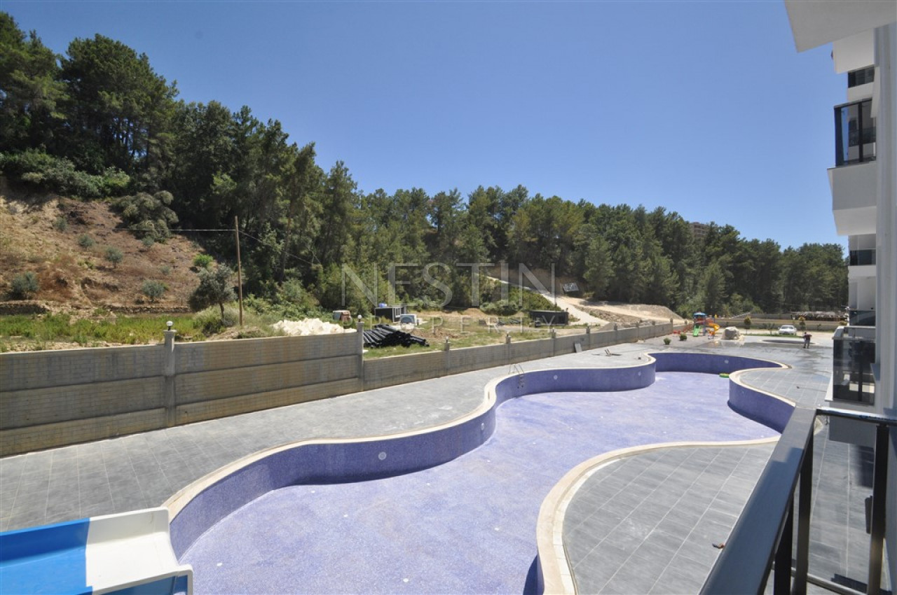 Меблированная квартира 1+1 в новом комплексе в районе Авсаллар фото 3