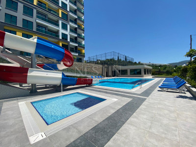 Продажа квартиры 1+1 в комплексе района Махмутлар фото 4