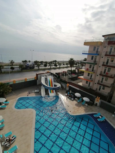 Апартаменты 1+1 в новом комплексе на первой береговой линии в районе Махмутлар фото 2