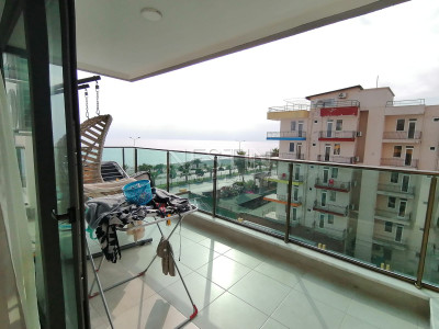 Апартаменты 1+1 в новом комплексе на первой береговой линии в районе Махмутлар фото 18