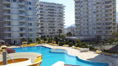 Квартира 2+1 в районе Тосмур в 50 метрах от моря фото 1