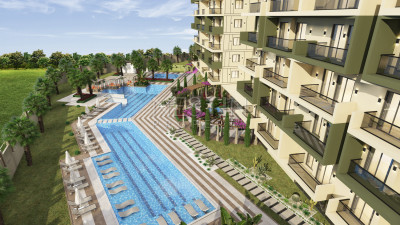 Квартиры 1+1 и 2+1 в новом ЖК на этапе строительства в районе Демирташ фото 7