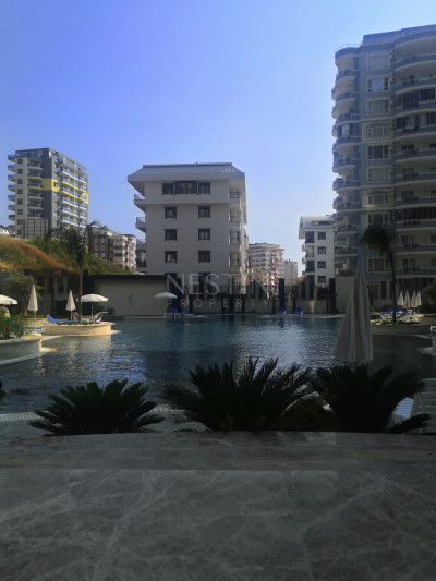 Квартира 1+1 с видом на горы в хорошем ЖК района Махмутлар фото 3