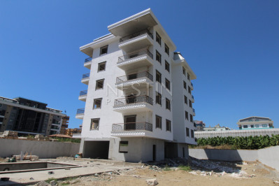 Квартира 1+1 в новом доме в районе Каргыджак в 200 м от моря фото 7