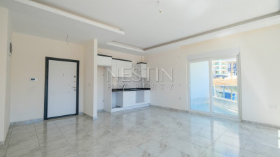 Новые апартаменты 2+1 в популярном районе Махмутлар, в 450 метрах от моря фото 6