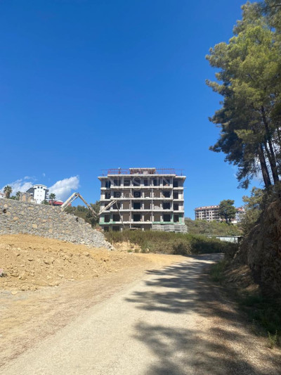 Квартира 1+1 в районе Авсаллар в 1500 м от Средиземного моря, в ЖК на стадии строительства фото 5