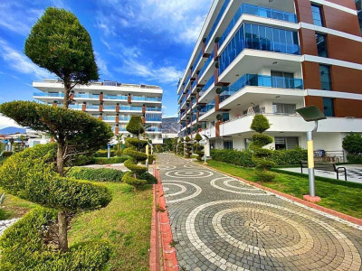 Квартира 2+1 в районе Кестель, в 300 м от Средиземного моря с видом на горы фото 1