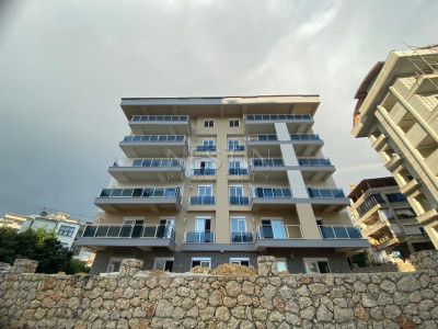 Квартира 2+1 в районе Джикджилли, в новом доме, в 2 км от Средиземного моря фото 1