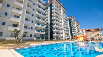 Квартира 1+1 в новом жилом комплексом, в районе Махмутлар в 450 м от Средиземного моря фото 1