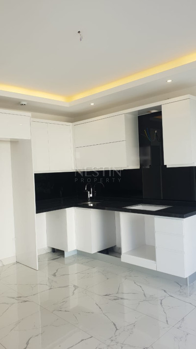 Квартира 1+1 в центре города Аланья в новом доме в 1000 м от Средиземного моря фото 3