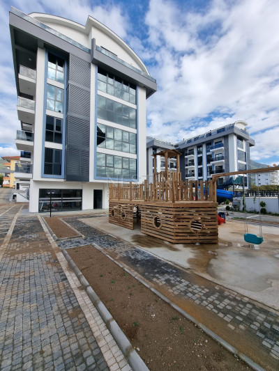 Квартира дуплекс 2+1 в районе верхней Обы в новом доме с видом на горы фото 1