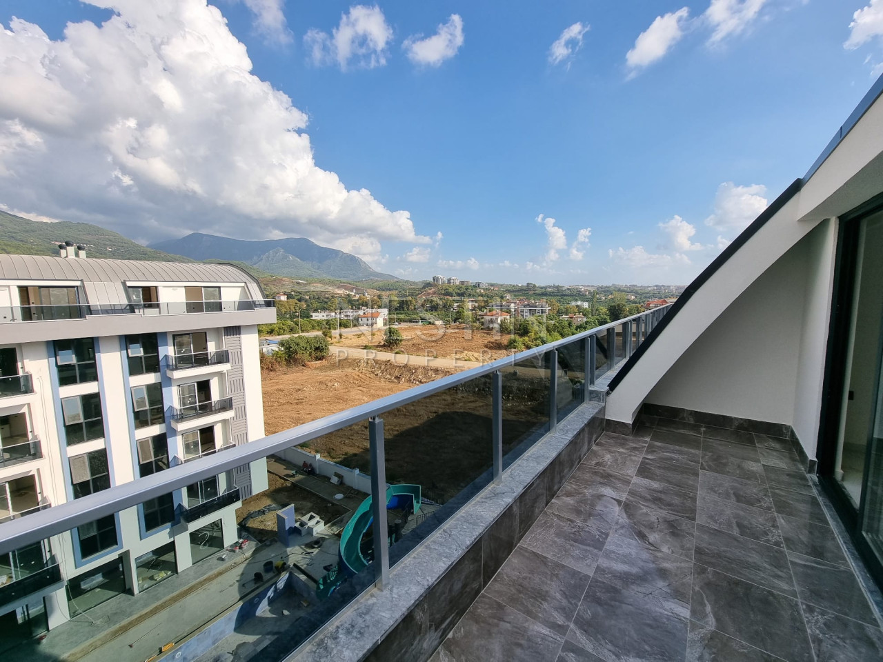 Квартира дуплекс 2+1 в районе верхней Обы в новом доме с видом на горы фото 11