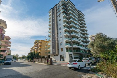 Меблированная квартира 1+1 в новом доме в Махмутларе в 300 метрах от моря фото 3