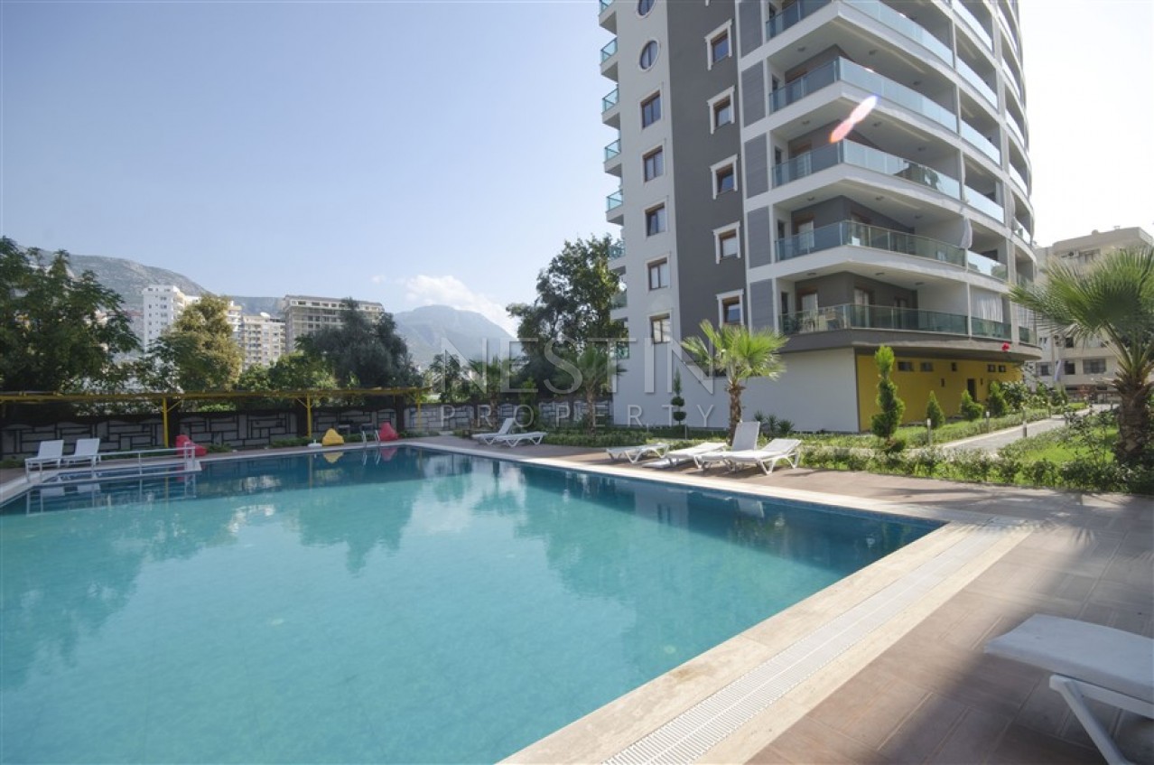 Меблированная квартира 1+1 в новом доме в Махмутларе в 300 метрах от моря фото 14