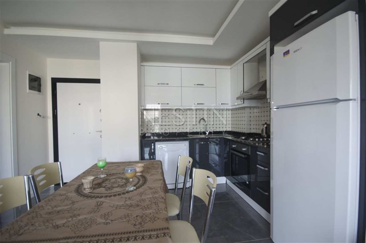 Меблированная квартира 1+1 в новом доме в Махмутларе в 300 метрах от моря фото 24