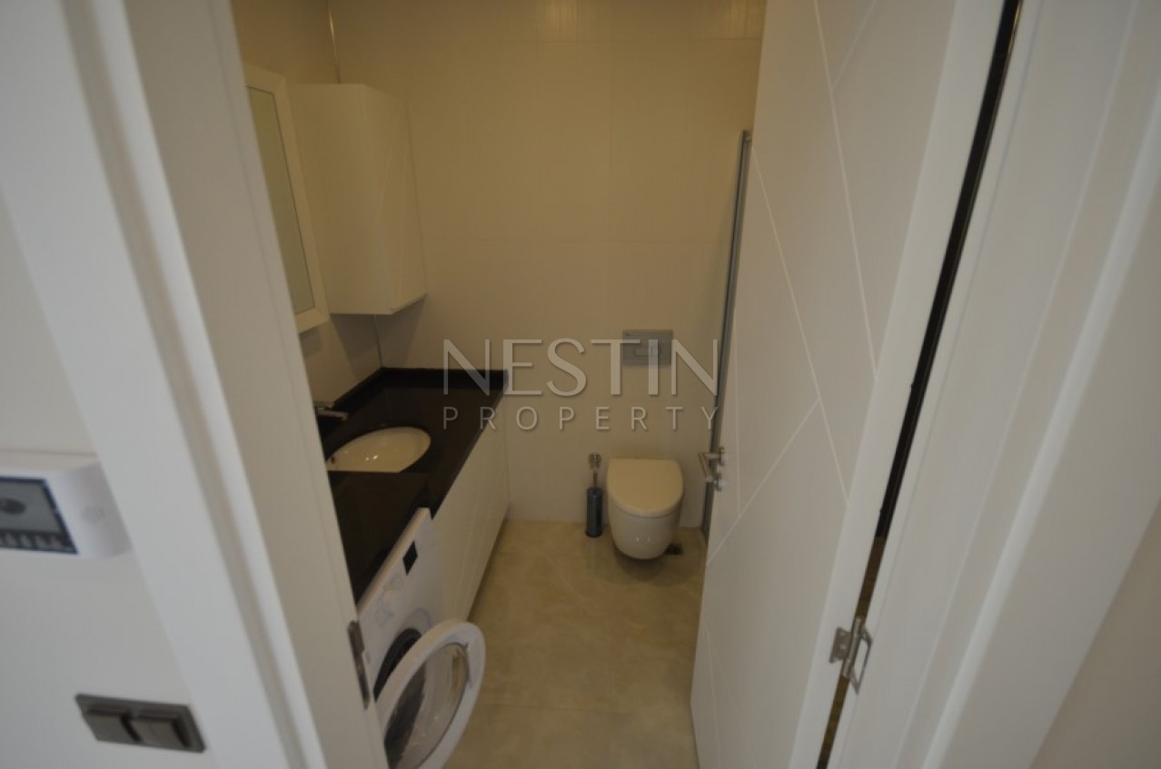 Апартаменты 2+1 в элитном жилом комплексе в Махмутларе на первой береговой линии фото 14