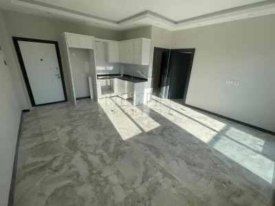 Квартира 1+1 в районе Авсаллар в новом жилом доме в 1500 м от Средиземного моря фото 4