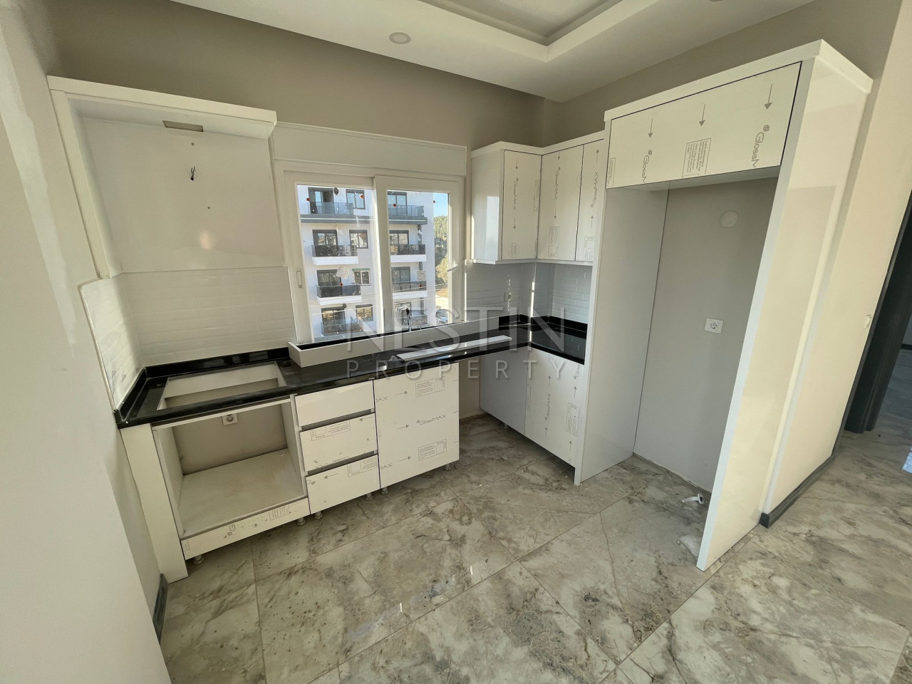 Квартира 1+1 в районе Авсаллар в новом жилом доме в 1500 м от Средиземного моря фото 2