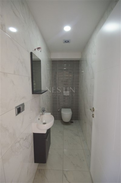 Прекрасный светлый пентхаус 2+1 в новой резиденции в центре Махмутлара фото 18