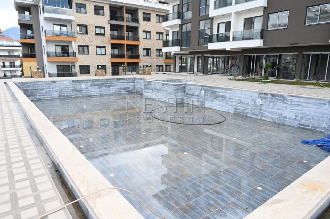 Квартира 1+1 в районе Оба, в новом жилом доме в 1200 м от Средиземного моря фото 10