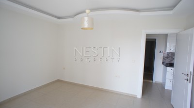 Недорогая квартира 1+1 в новом доме с бассейном в центре Махмутлара фото 19