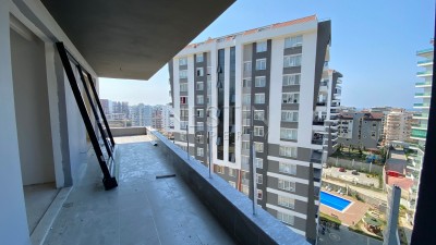 Просторные апартаменты 3+1 с отдельной кухней в новом жилом комплексе в Махмутларе фото 18