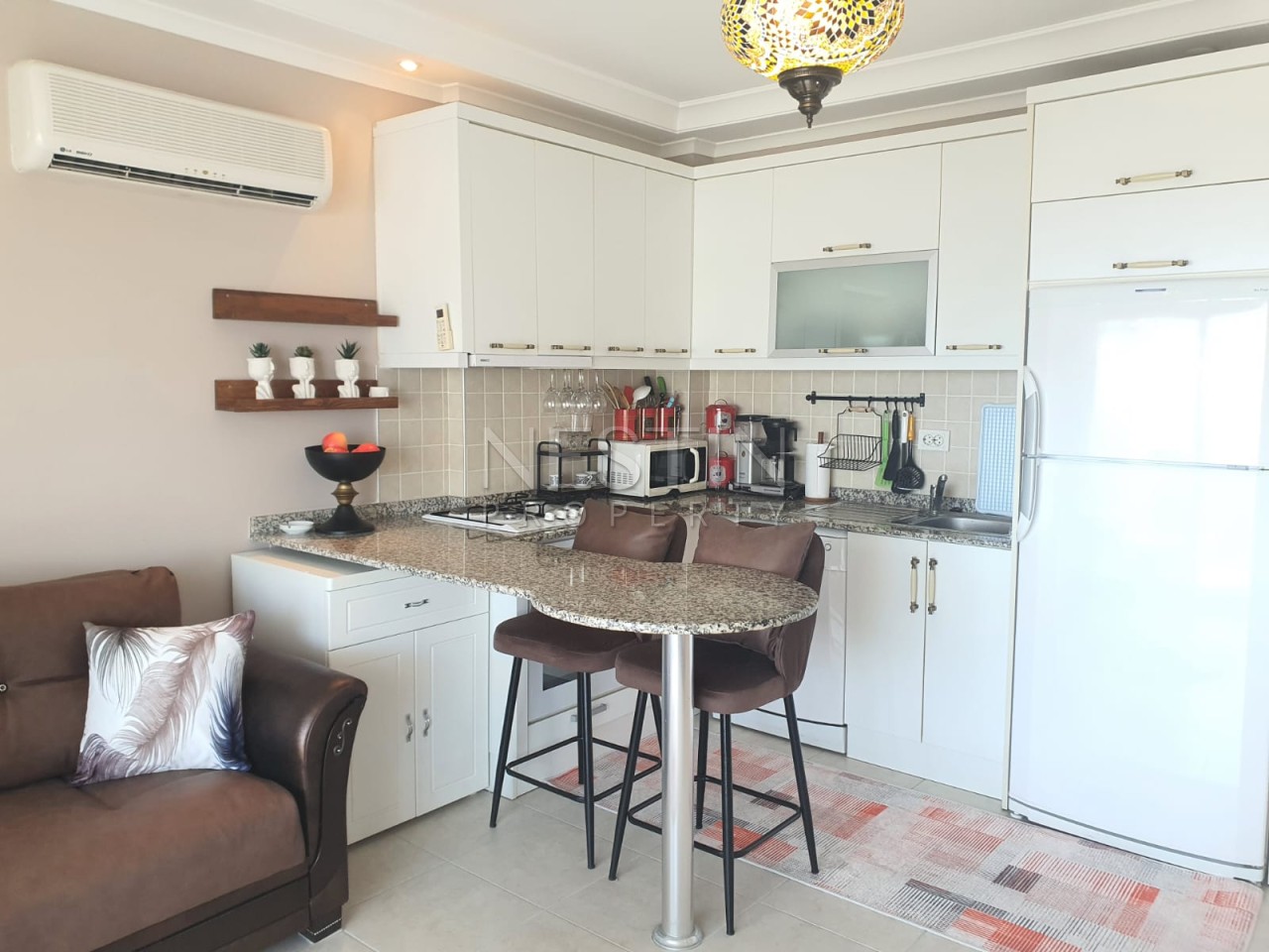 Квартира 1+1 в районе Джикджилли с видом на море и горы фото 3