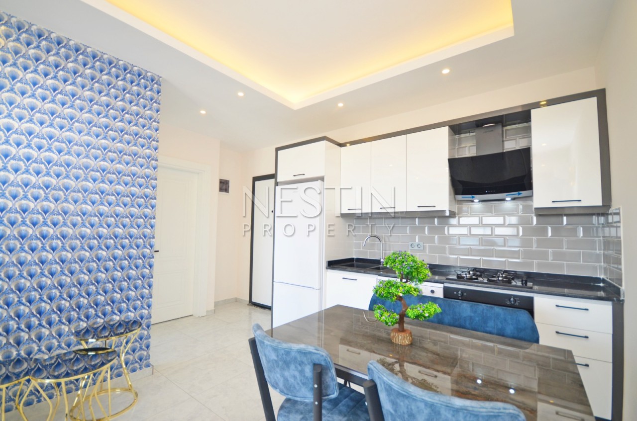 Квартира 1+1 в районе Авсаллар в новом жилом доме с видом на море фото 2