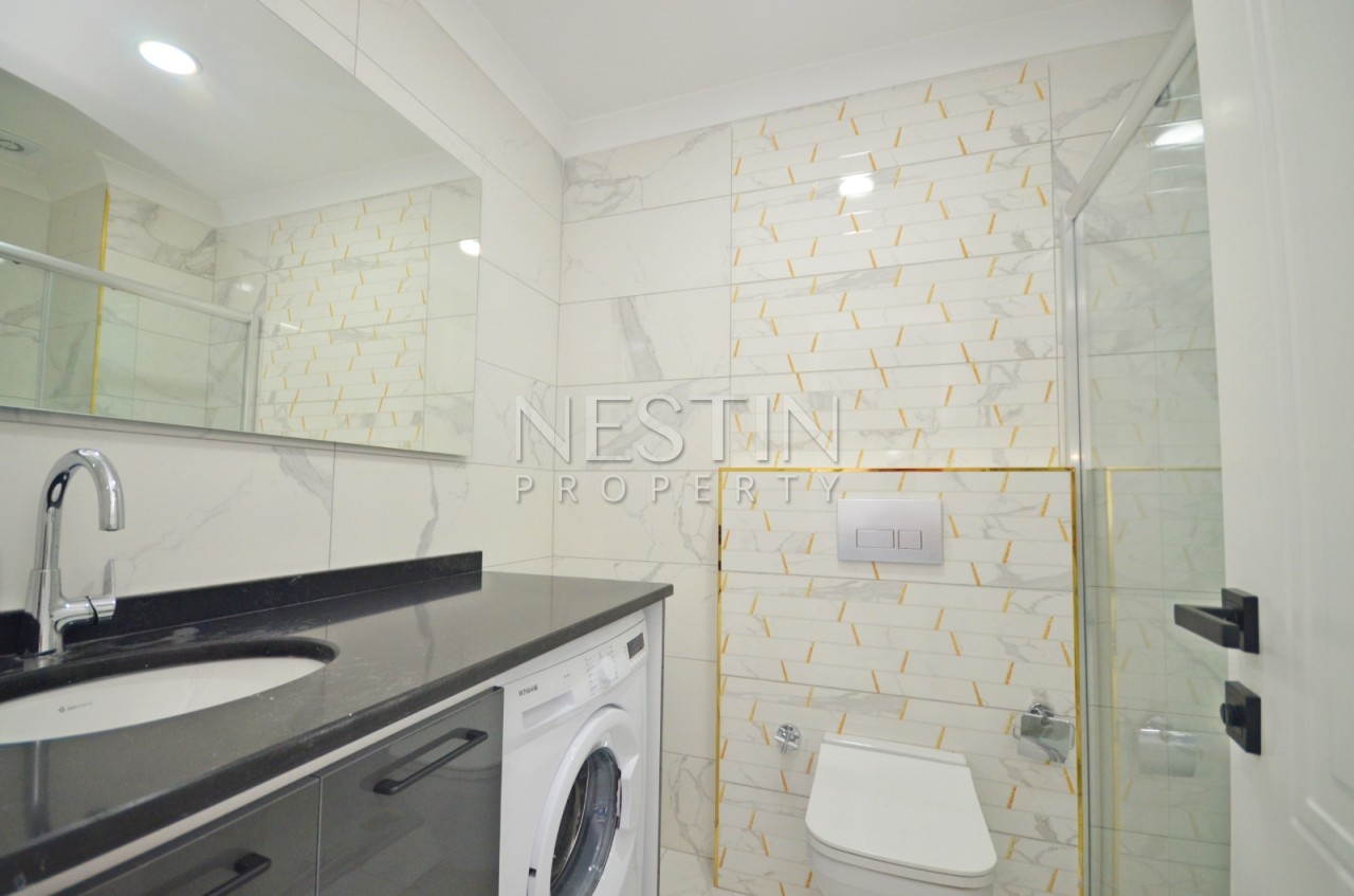 Квартира 1+1 в районе Авсаллар в новом жилом доме с видом на море фото 11