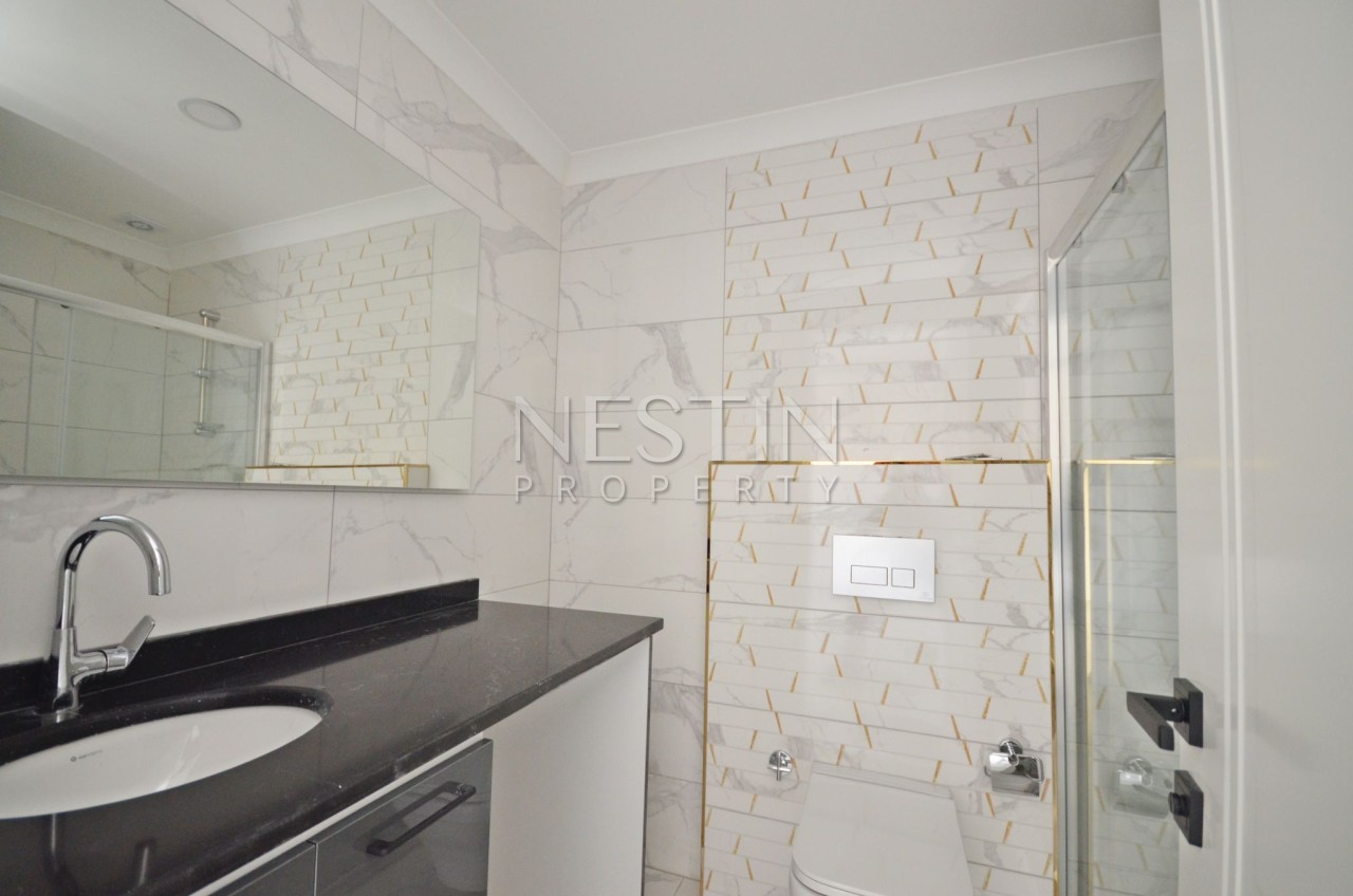 Квартира 1+1 в районе Авсаллар в новом доме с видом на море фото 12