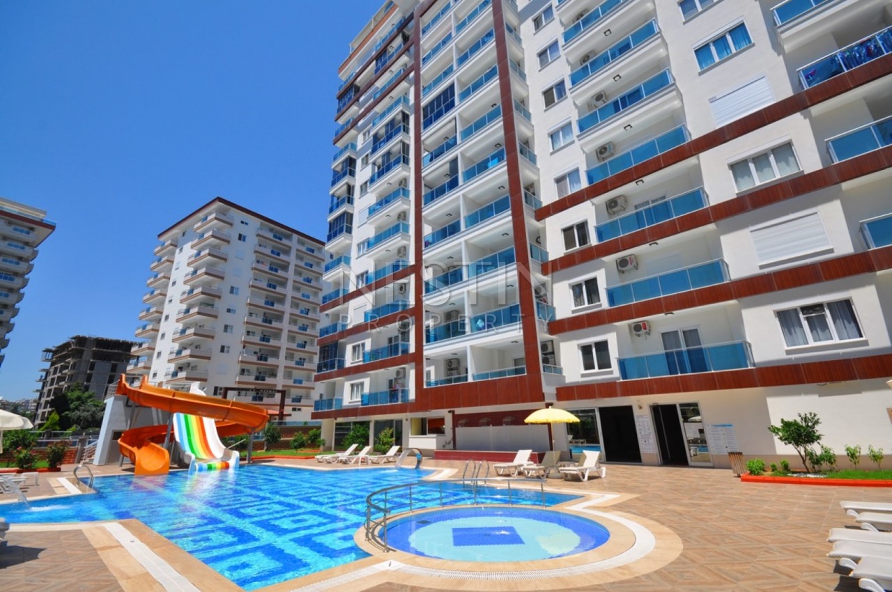 Апартаменты 1+1 в современном комплексе в Махмутларе фото 1