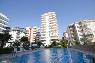 Меблированные апартаменты 2+1 в центре Махмутлара с видом на море в ухоженном комплексе фото 1