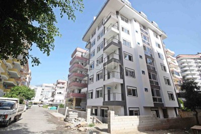 Абсолютно новая квартира 1+1 с панорамными окнами в центре Махмутлара фото 1