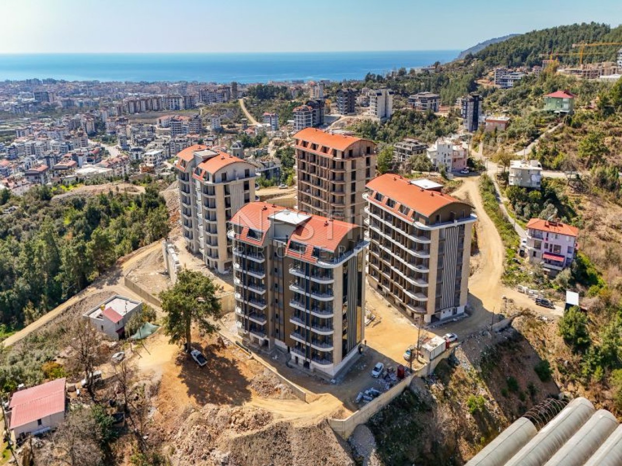Hовый жилой комплекс на стадии строительства в центре Алании в районе Чиплаклы в 2800 метрах от Cредиземного моря. фото 3