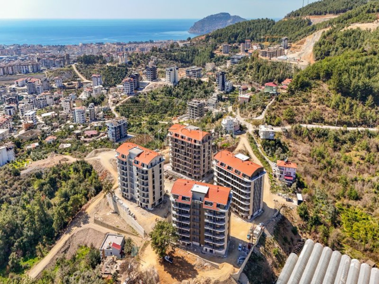 Hовый жилой комплекс на стадии строительства в центре Алании в районе Чиплаклы в 2800 метрах от Cредиземного моря. фото 4