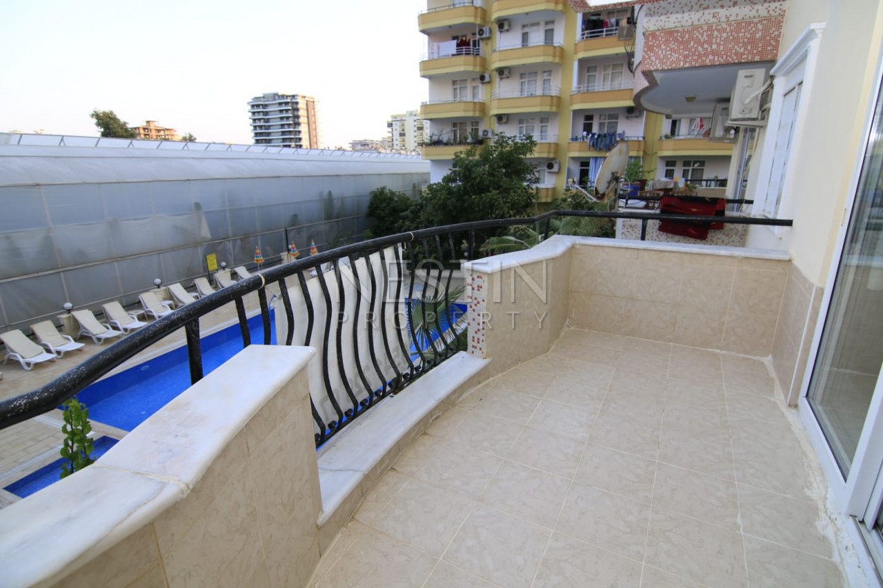 Меблированные апартаменты 2+1 с видом на бассейн в Махмутларе фото 3