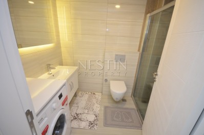 Апартаменты 1+1 в новом комплексе с видом на море в центре района Махмутлар фото 19