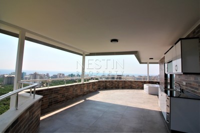 Просторный двухэтажный пентхаус 4+1 с панорамным видом на море в Махмутларе фото 8