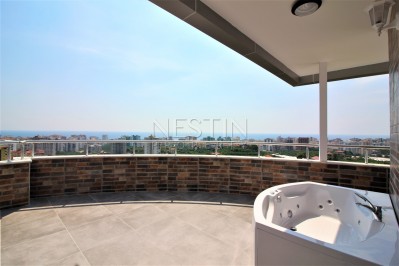 Просторный двухэтажный пентхаус 4+1 с панорамным видом на море в Махмутларе фото 13