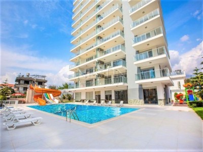 Просторная квартира 1+1 в новом комплексе в районе Махмутлар фото 1