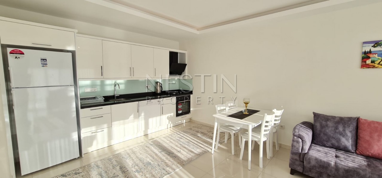 Просторная квартира 1+1 в новом комплексе в районе Махмутлар фото 18