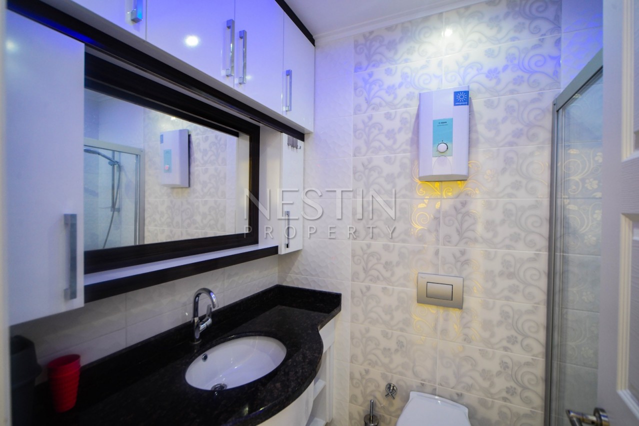 Красивая квартира 1+1 от надежного застройщика с видом на море в Махмутлар фото 15