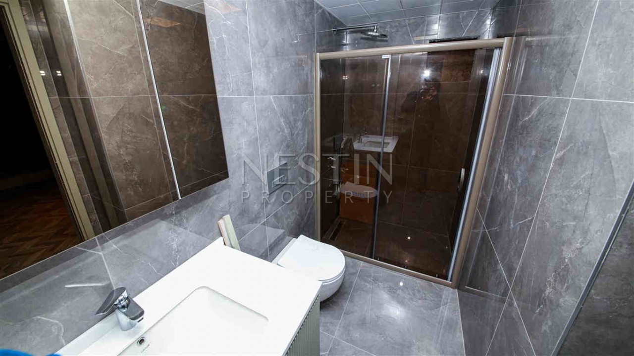 Стильные квартиры в новом жилом комплексе в центре Анталии фото 19