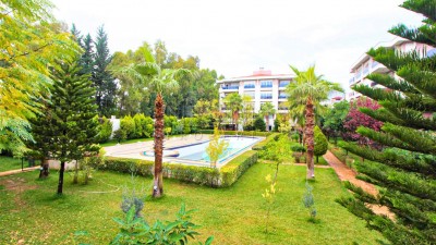 Светлая квартира в доме с инфраструктурой и большим садом в Коньяалты фото 3