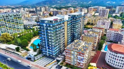 Квартира 2+1 в новом доме на берегу моря в Махмутларе фото 1