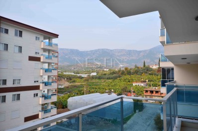 Большая квартира 2+1 в районе Махмутлар с видом на горы фото 13