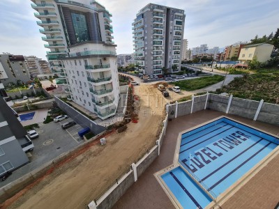 Просторная квартира в новом комплексе 3+1 в центре Махмутлара в 350 метрах от моря фото 3