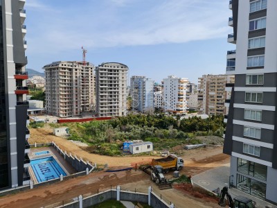 Просторная квартира в новом комплексе 3+1 в центре Махмутлара в 350 метрах от моря фото 6